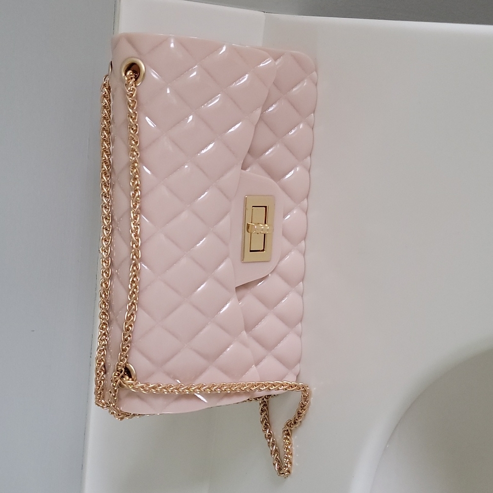 Pink plastic quilted shoulder bag